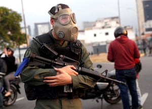 A soldier wear a gas mask in Caracas
