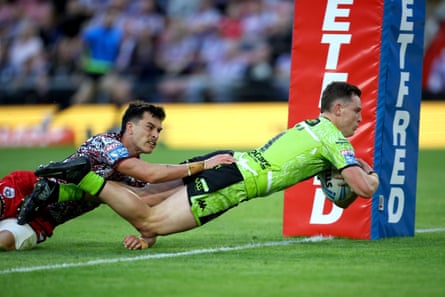 Jai Field dives over for Wigan’s first try of the night in their victory