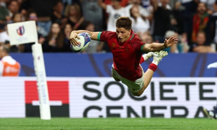 Portugal’s Rodrigo Marta dives in to score the decisive try in a sensationa win against Fiji.