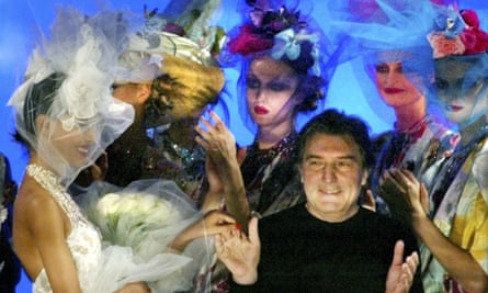 Emanuel Ungaro acknowledging applause at the end of his spring summer haute couture 2003 fashion collection presented in Paris.