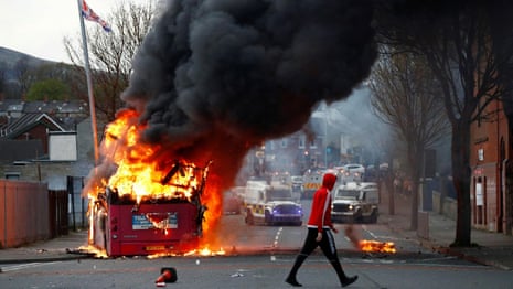 Protesters in Belfast hijack bus and set it on fire – video