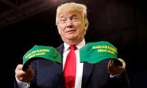 Trump with a pair of ‘Make America Great Again’ hats at a rally in Indiana in August last year. Trump tweeted: ‘The Farmers have been forgotten for many years. Their time is now!’ 3446.jpg?width=300&quality=85&auto=forma