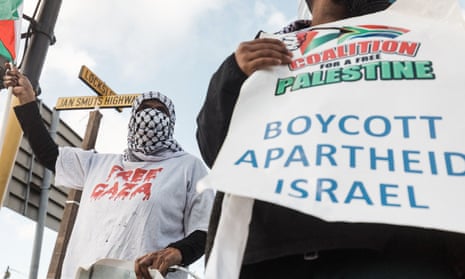 Pro-Palestinian supporters hold placards reading ‘Boycott Apartheid Israel’ during a protest to condemn the ongoing Israeli air strikes on Gaza, in Durban, South Africa, this week.