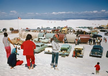 New Mexico, 1957, William Belknap Jr. Picnickers gather at Great White Sands, where snowy-soft gypsum forms a 140,000-acre sandbox. Curving shields protect picnic tables from the blowing wind and glaring sun.