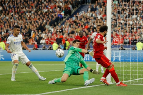 Thibaut Courtois saves from Mohamed Salah in the second half.