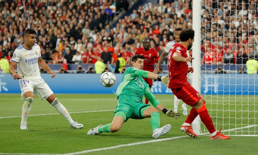 Thibaut Courtois saves from Mohamed Salah in the second half, one of several vital stops.
