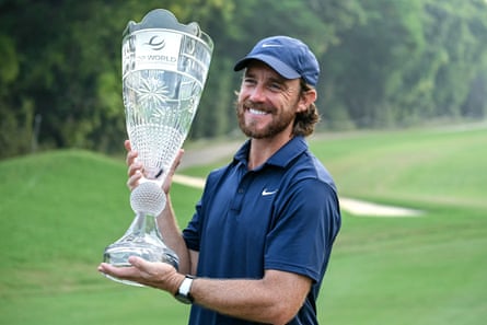 Tommy Fleetwood holds the World India Championship trophy.