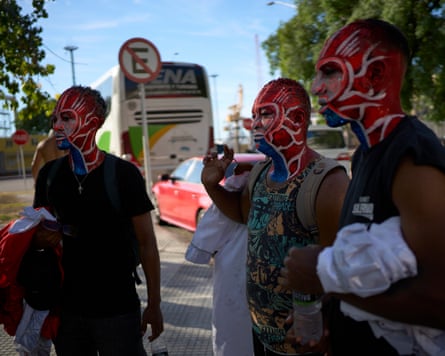Members of the Comparsa Valores de Ansina prepare for a performance.