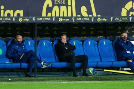 Ronald Koeman watches on from the dugout.