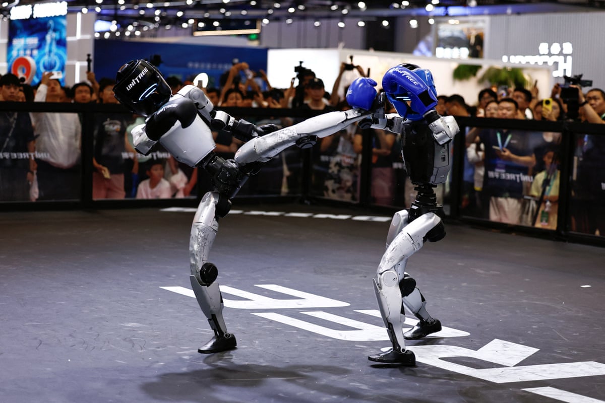 Humanoid robots by Unitree Robotics demonstrate kickboxing during the 2026 World Robot Conference, in Beijing on 19 August.