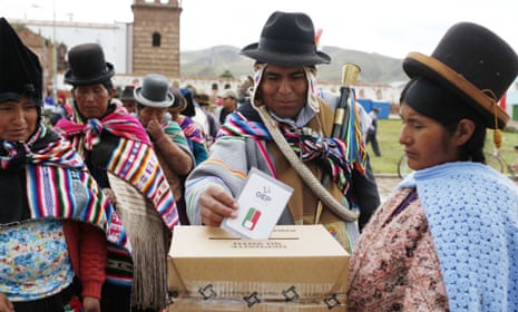 An Aymara Indian casts his ballot at a voting centre during the constitution referendum in Jesus de Machaca, Bolivia.