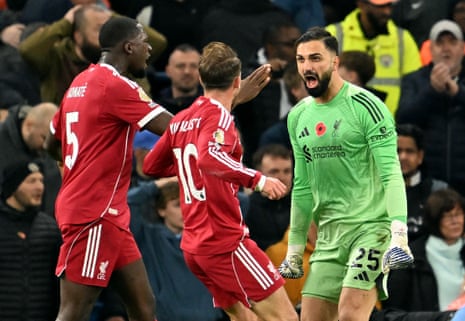 Mamardashvili celebrates with Ibrahima Konate and Alexis Mac Allister.