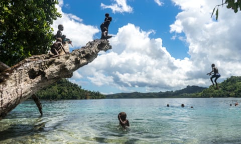 Children swim in the Nggela islands, part of the Solomon Islands, which in September made the decision to sever ties with Taiwan and recognise China.