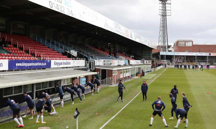 Hereford players warm up at Edgar Street in March 2021.