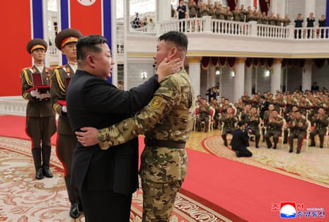 North Korean leader Kim Jong-un embracing a serviceman as he attends a ceremony to award state commendations to the commander and combatants of the Korean People's Army's Overseas Operational Forces, who took part in military operations in Kursk Oblast to help Russia in its war against Ukraine.