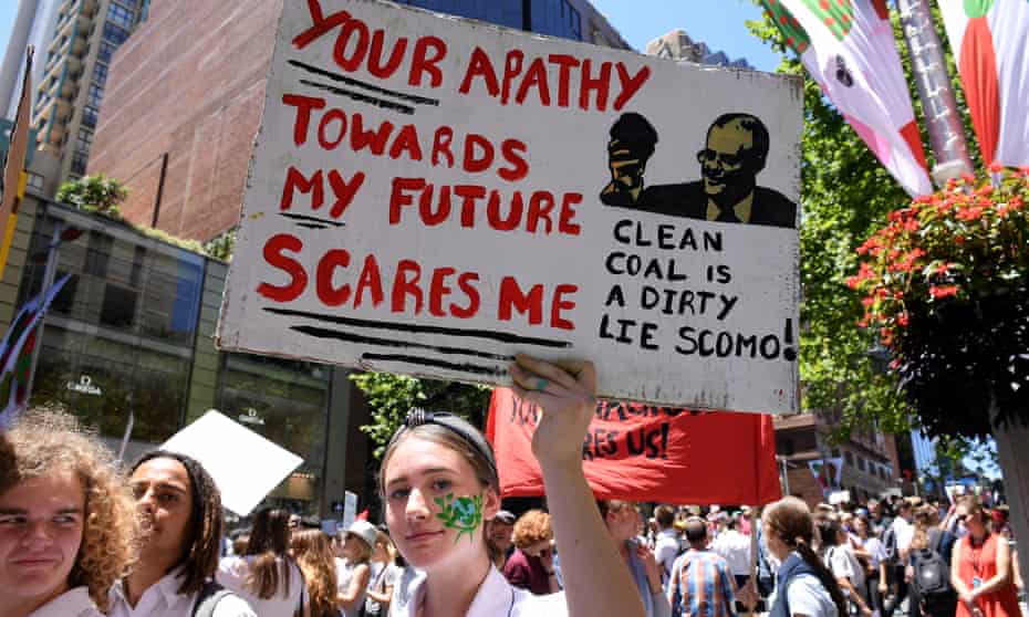 Saskia Cook-Knowles of Port Kembla high school holds a placard during a student rally on climate change last November.