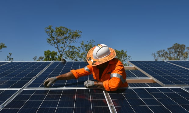 Northern Territory workers install solar panels in Daly River, August 11, 2017. 