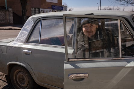 Dmytro Yakhshyboyev in his damaged car