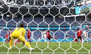 The ball deflects off Denis Zakaria of Switzerland from a shot by Jordi Alba to give Spain the lead.