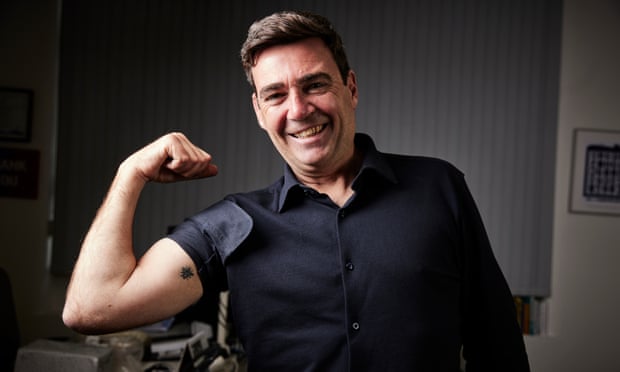 Burnham shows off his tattoo of a bee, the civic emblem of Manchester.