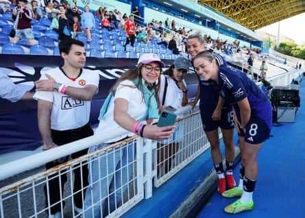 Manchester United’s Celin Bizet and Grace Clinton (right) pose for a photo with a member of the crowd following their win against Roma.