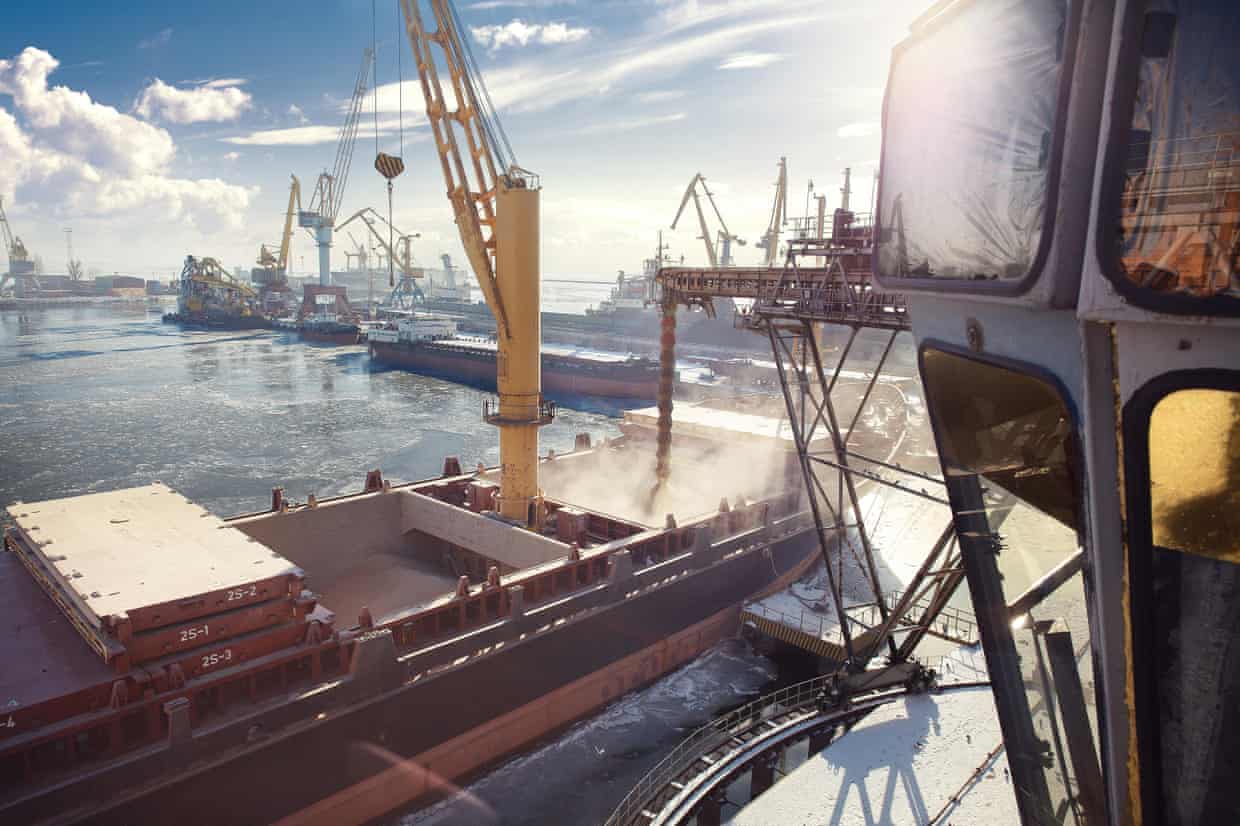 Grain is loaded into a ship’s granary, in Mariupol, Ukraine.