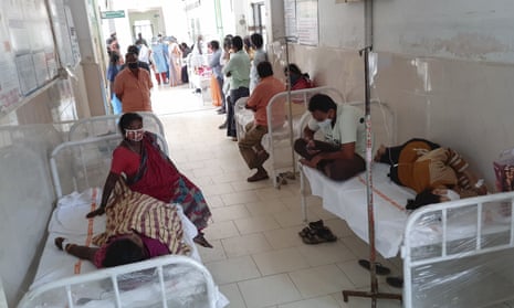 Patients and bystanders in hospital in Eluru, Andhra Pradesh, on Sunday