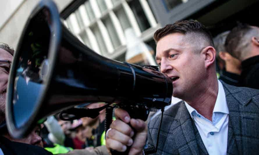 Tommy Robinson greets supporters outside the Old Bailey after his case was adjourned.