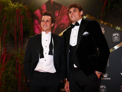 Ed Curnow and Charlie Curnow of the Carlton Blues poses as they arrive.