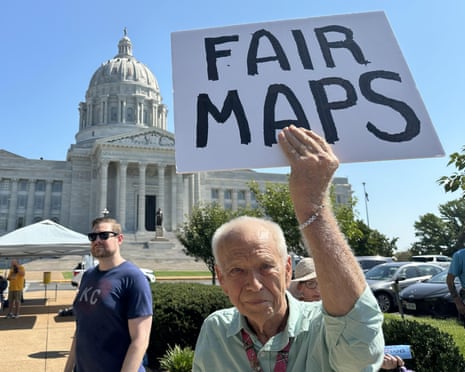 Election 2026 Redistricting MissouriThis photo taken with a smartphone shows Steve Perry, of Kansas City, holding a sign in opposition to Missouri’s congressional redistricting plan on Wednesday, Sept. 2, 2026, outside the state Capitol, in Jefferson City, Mo. (AP Photo/David A. Lieb)