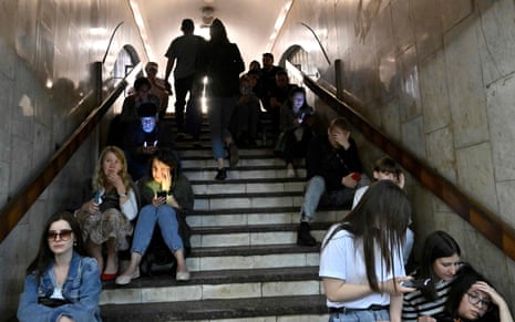 Local residents take shelter in a metro station in the centre of Kyiv.