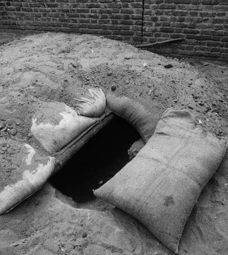 Sandbags around the opening of a bunker on a street