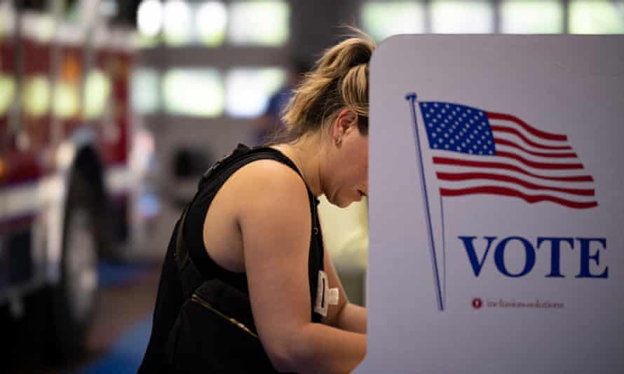 A voter casts her ballot in the Pennsylvania primary elections at the Rockledge Fire Company in Rockledge, Pennsylvania.