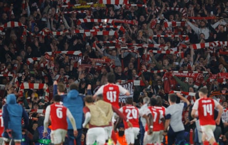 Arsenal players celebrate in front of their joyous fans during the Champions League 2025/26 semi-final second leg match against Atlético Madrid