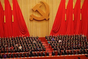 Chinese President Xi Jinping and other high ranking officials clap their hands during the opening session of the 19th National Congress of the Communist Party of China.