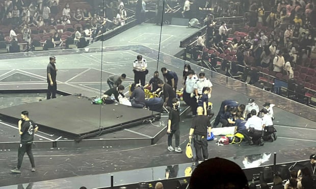 Two dancers receive medical treatment after the LED screen fell at the concert