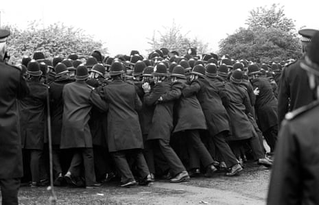 Police officers pushing against striking miners outside the Orgreave Coking Plant near Rotheram.