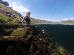 Jenny, left, and Vivienne prepare to brave the waters, in this image which shows writer and guest about to get into Llynnau Cwm Silyn