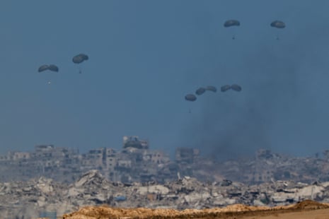 Humanitarian aid packages are airdropped over the Gaza Strip, as seen from Israel, 1 August 2025.