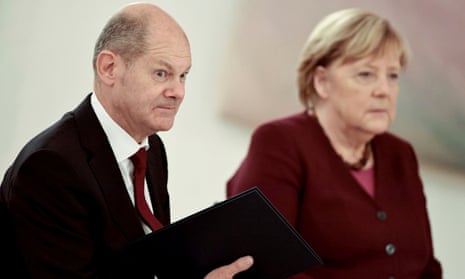 Olaf Scholz (left) and Angela Merkel in Berlin on Tuesday