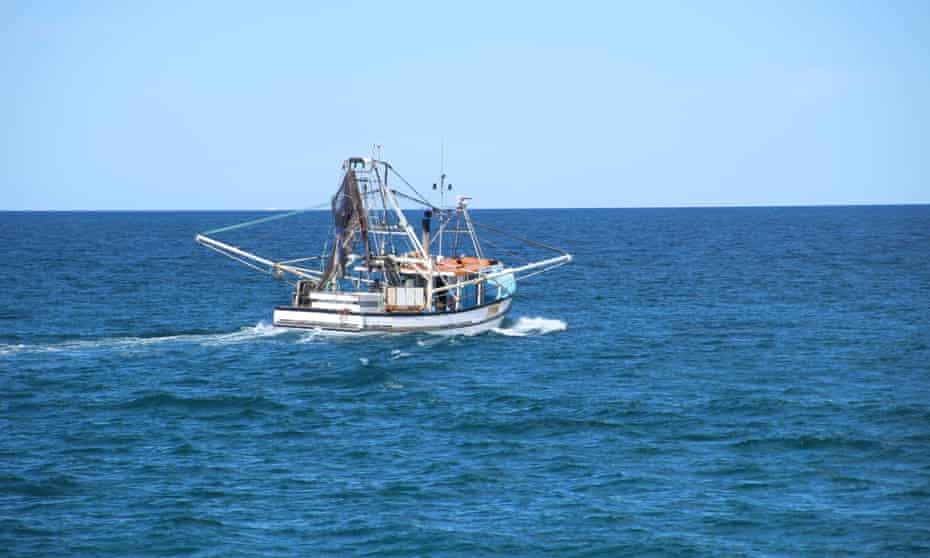 Fishing trawler boat heading out to sea