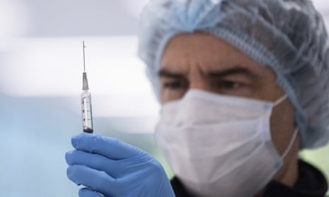 A technician prepares a Pfizer vaccine in the pharmacy area of the COVID-19 Vaccination Centre in Sydney, Australia, May 10, 2021.