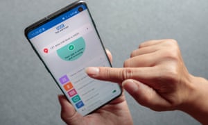 A person using the NHS Covid app on an iPhone