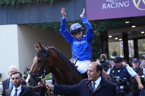 William Buick on Ombudsman celebrates after winning the Qatar Racing Champion Stakes