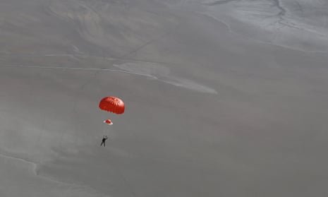 Peter Siebold, the pilot of Virgin Galactic’s SpaceShipTwo, parachuting to safety after its crash. The co-pilot, Michael Alsbury, was killed.