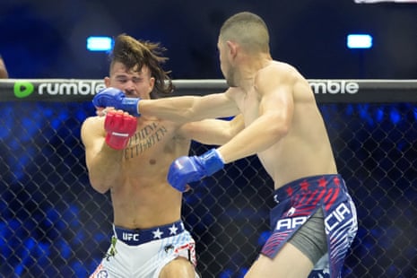 Steve Garcia, right, lands a blow on Diego Lopes during Saturday’s fight.