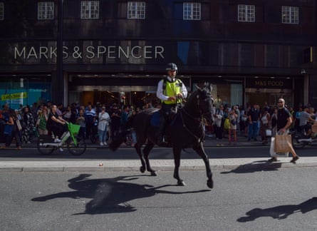 Police patrol Oxford Street, London, during a mass shoplifting event in August 2023.