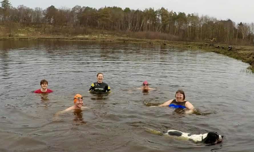 Ella Foote ( right) with friends and Beano the dog swimming in a Chobham Common pond