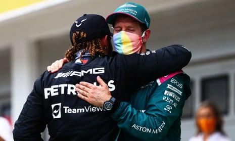 Lewis Hamilton and Sebastian Vettel embrace at the Hungarian Grand Prix on Sunday