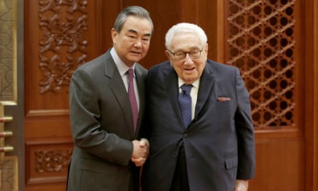 Chinese Foreign Minister Wang Yi shakes hands with former US Secretary of State Henry Kissinger at the Great Hall of the People in Beijing in November.